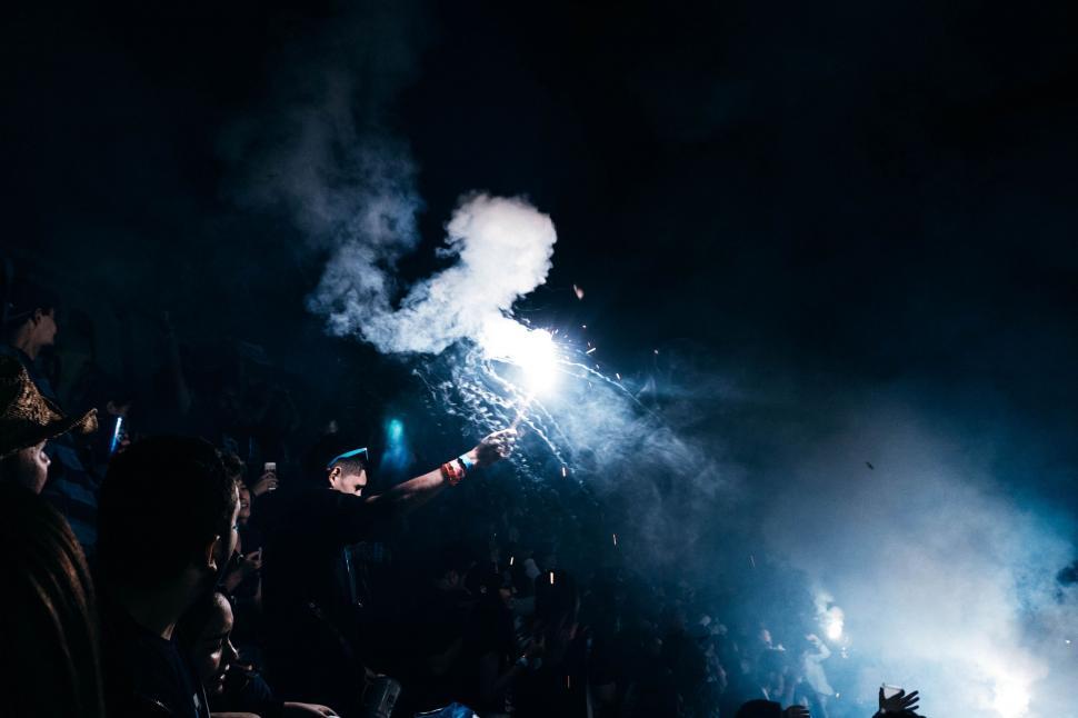 Free Image of Crowd of People Watching Fireworks in the Dark 