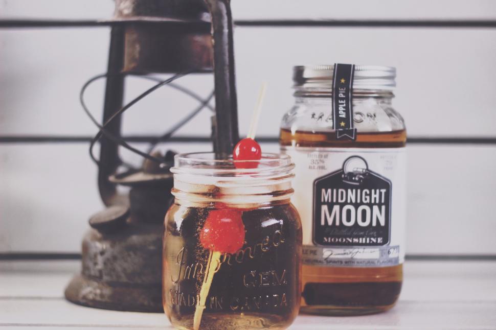 Free Image of Two Jars of Liquid on a Table 