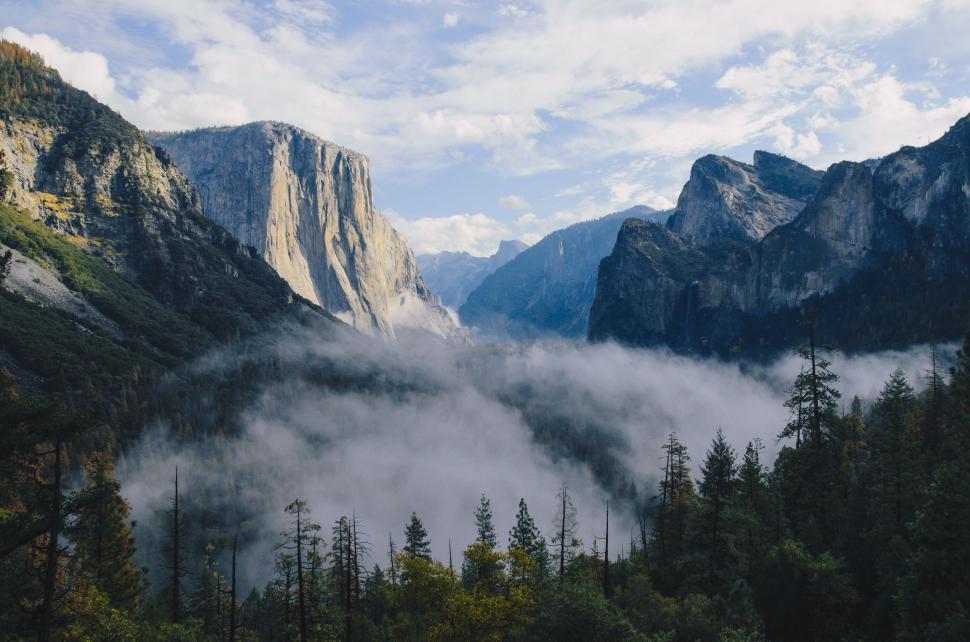 Free Image of Clouds Blanketing Mountain Range 