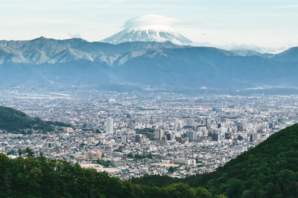 Free Image of Cityscape With Mountain in Background 