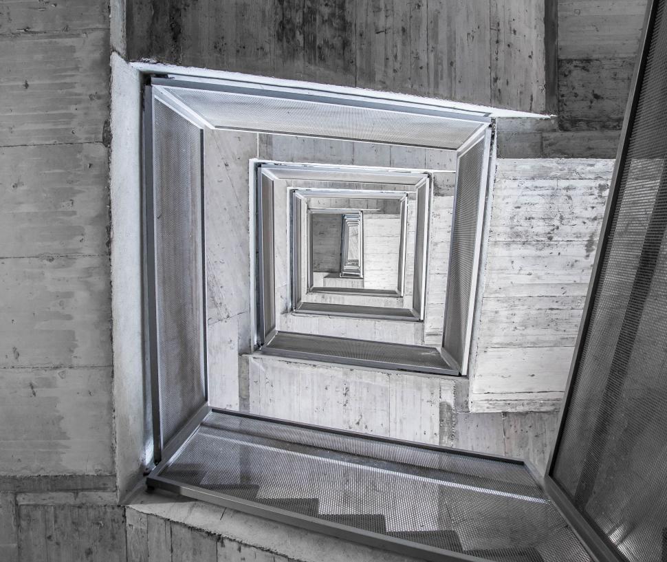 Free Image of A Black and White Photo of a Stairwell 