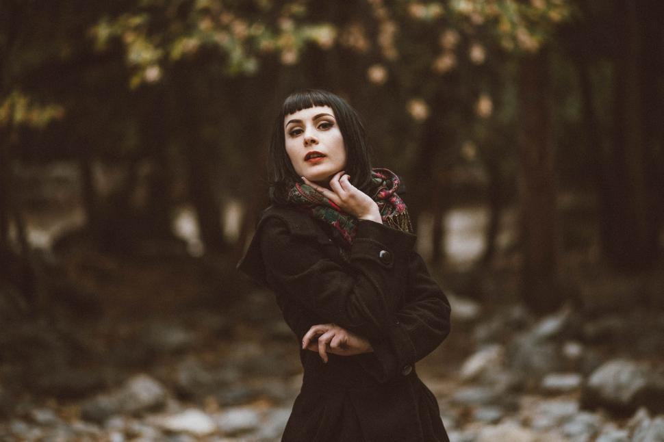 Free Image of Woman in Black Dress Standing in Forest 