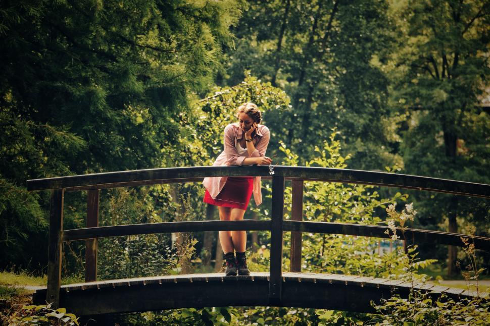 Free Image of Woman Standing Bridge Woods 