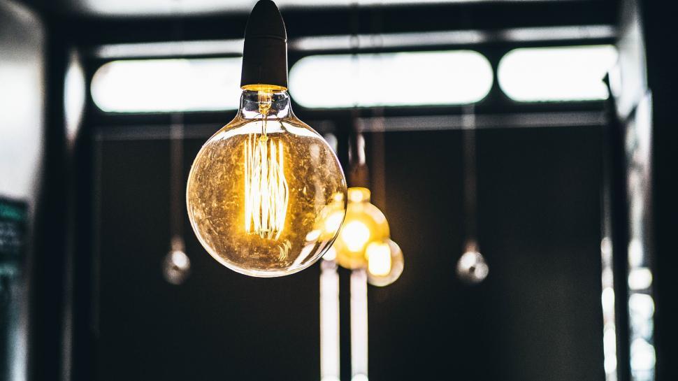 Free Image of Light Bulb Hanging From Metal Pole 