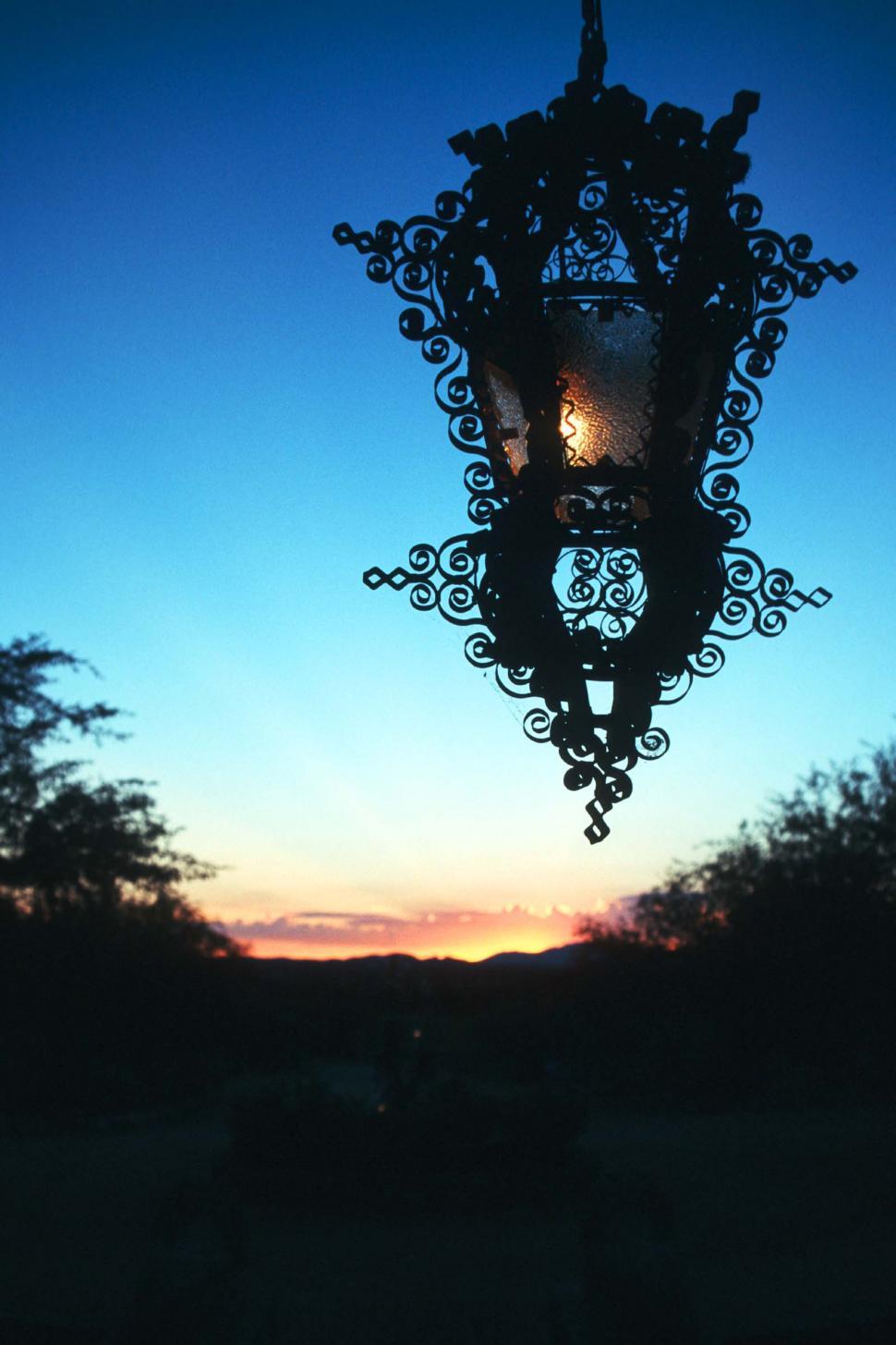 Free Image of Lamp Hanging From Side of Building 