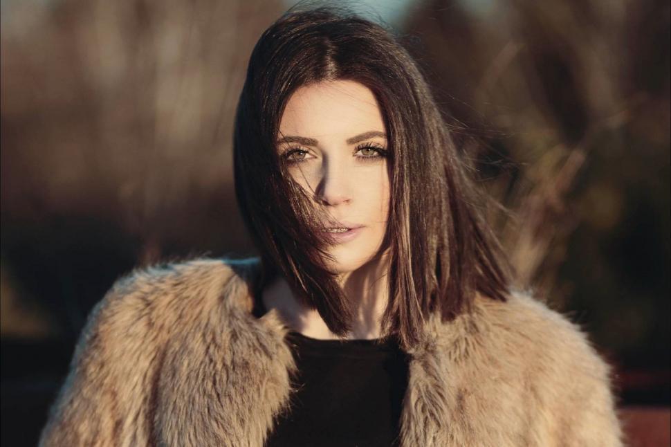 Free Image of Woman With Long Hair Wearing Fur Coat 