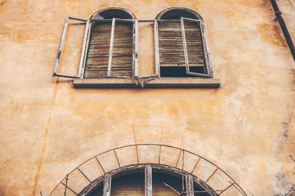 Free Image of Old Building With Two Windows and a Spiral Staircase 