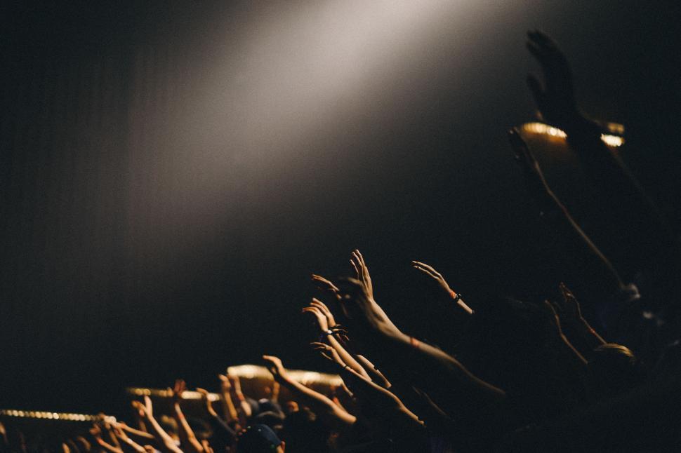 Free Image of Group of People Standing on Top of a Stage 