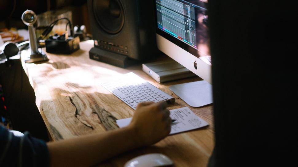 Free Image of Person Sitting at Desk With Computer 