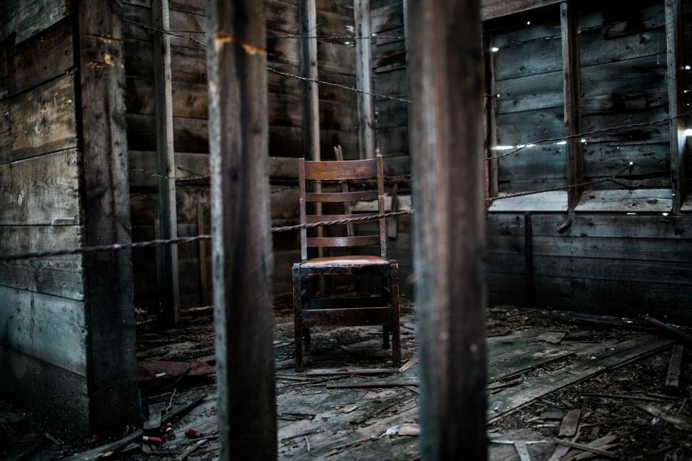 Free Image of Chair in Room With Wooden Walls 