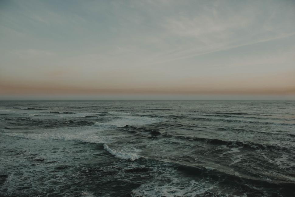Free Image of Waves Crashing on Black and White Ocean Shore 