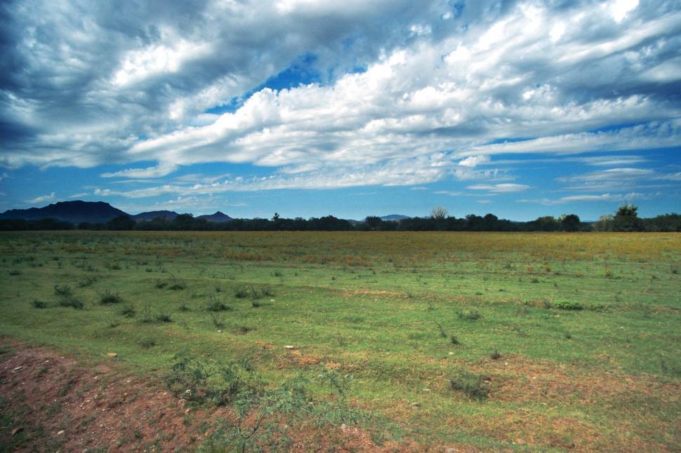 Free Image of Wide Open Field With Blue Sky Background 