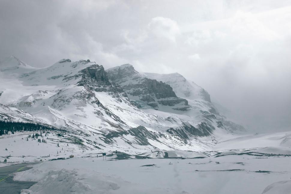 Free Image of Snowy Mountain Under Cloudy Sky 