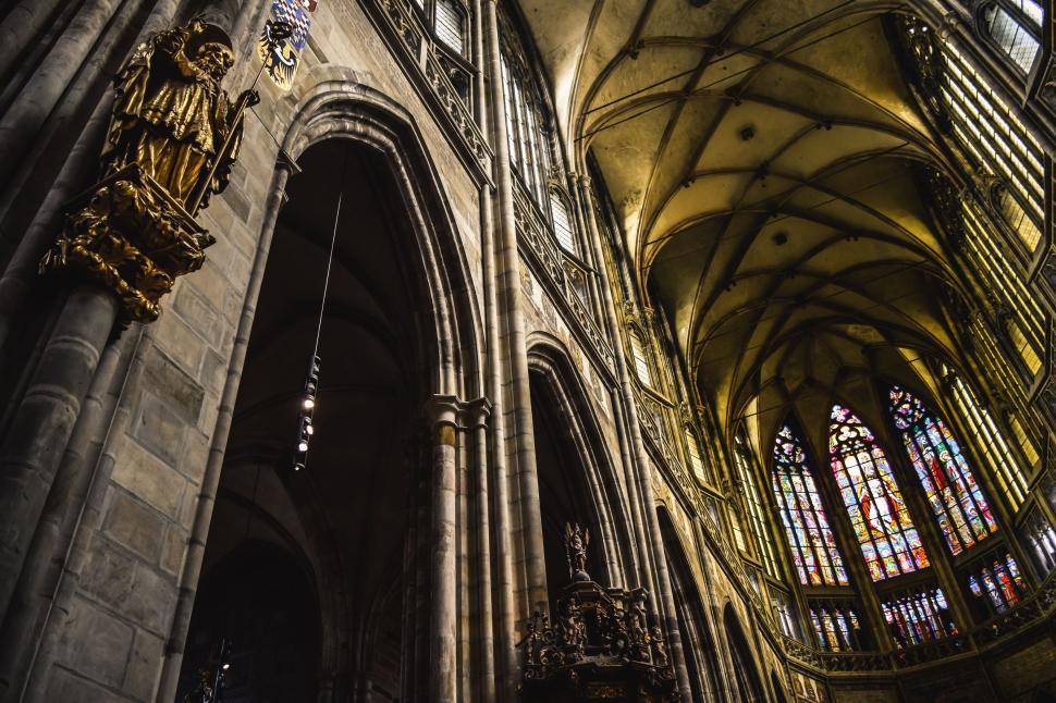 Free Image of The Grand Interior of a Cathedral With Stained Glass Windows 