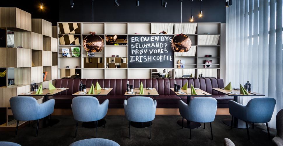 Free Image of Blue Chairs Restaurant With Menu on Wall 