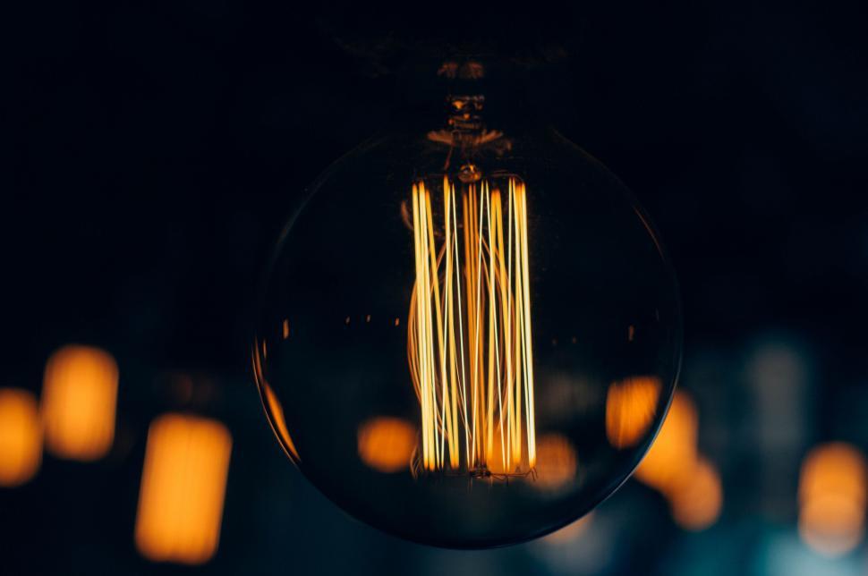 Free Image of Close-Up of a Light Bulb in a Dark Room 