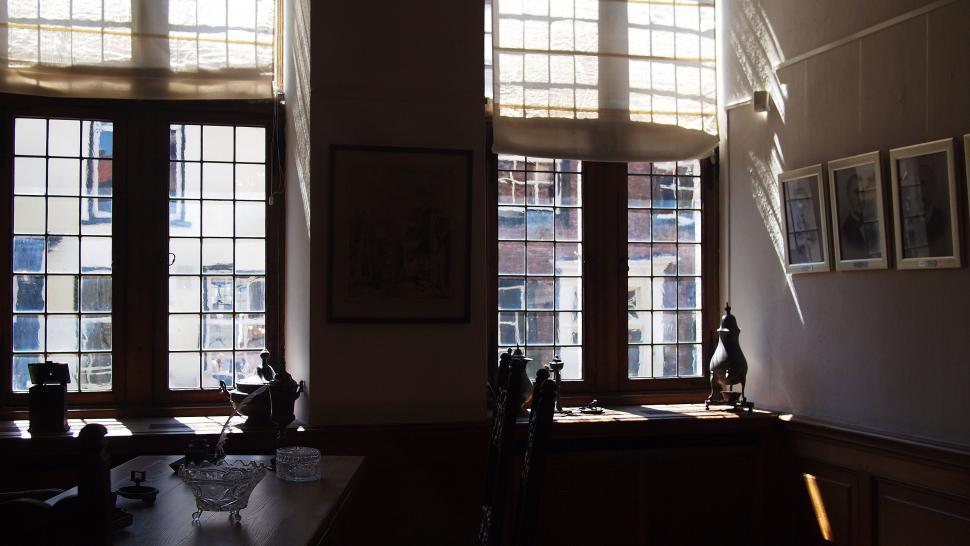 Free Image of Sun Shines Through Windows in Dark Room 