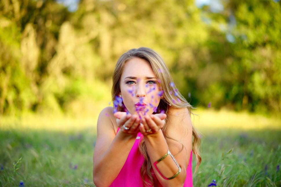 Free Image of Woman in Pink Dress Sitting in Field 
