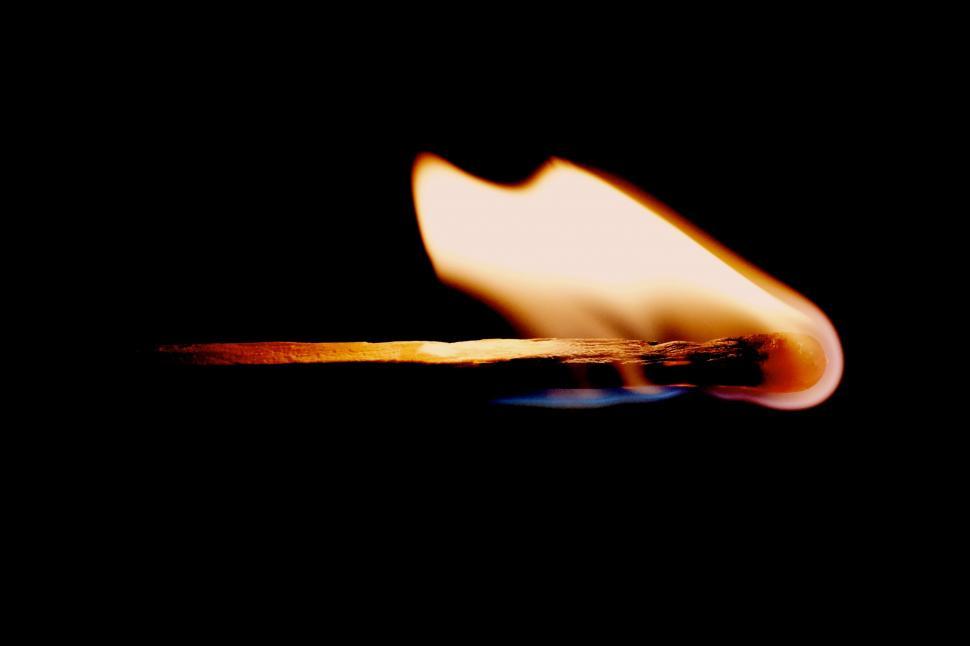 Free Image of Illuminated Matchstick in Dark Setting 