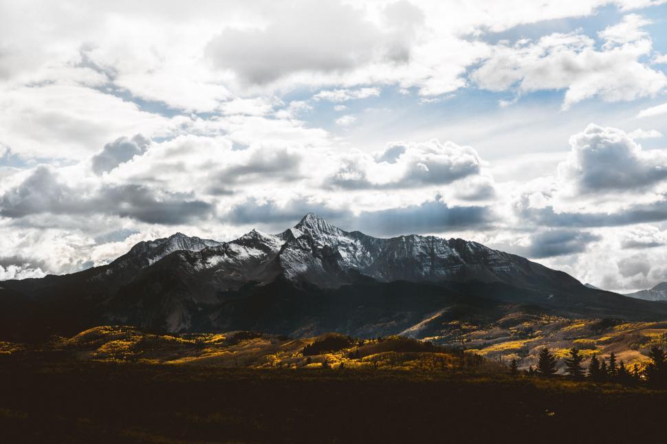 Free Image of Majestic Mountain Range Under Cloudy Sky 
