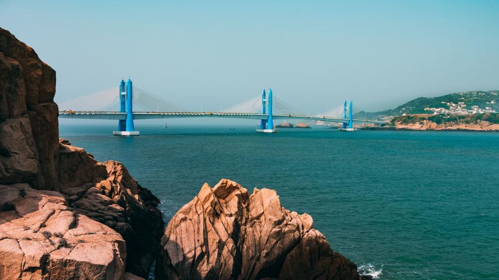 Free Image of Majestic Bridge Over Vast Waterway 
