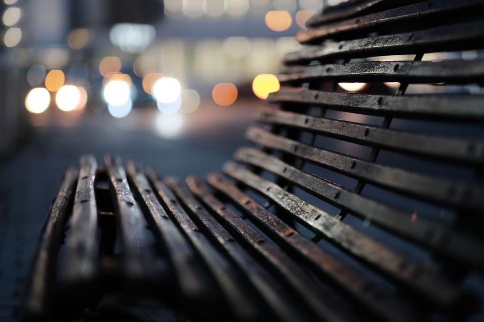 Free Image of Close Up of Wooden Bench on City Street 