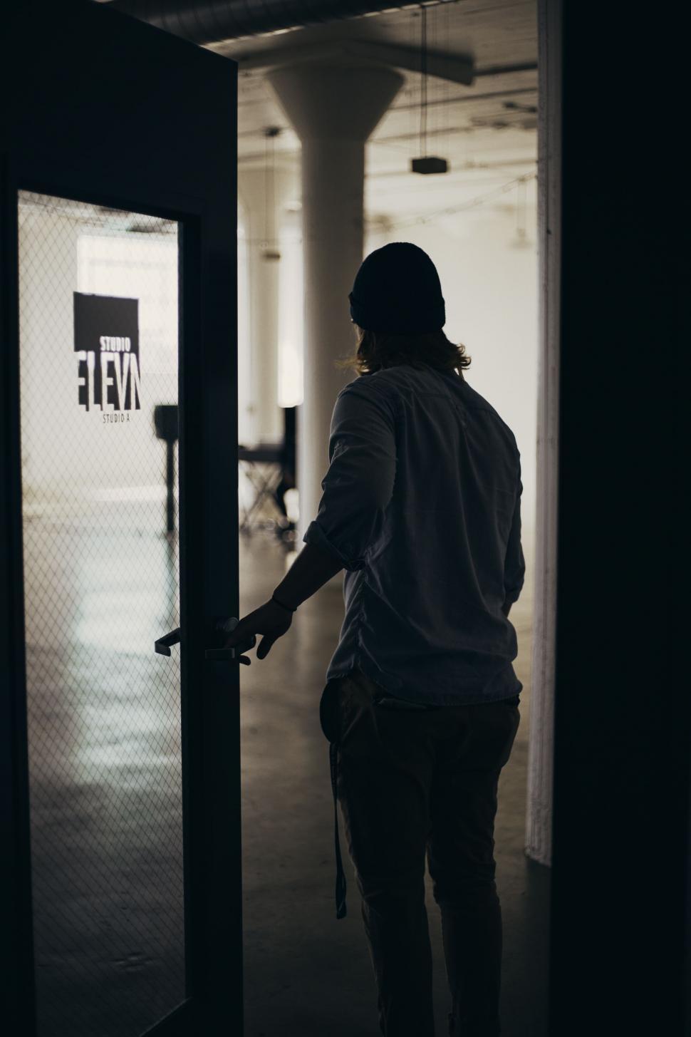 Free Image of Woman Entering Building 