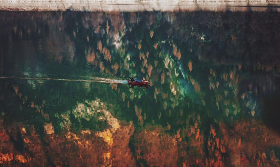 Free Image of Boat Floating on Top of Body of Water 
