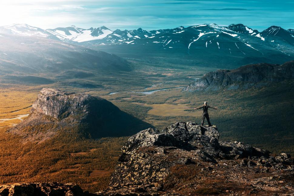 Free Image of Person Standing on Top of a Mountain 