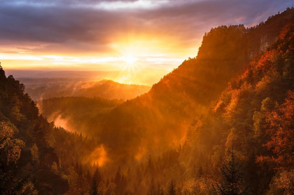 Free Image of Sun Setting Over Mountain Range 