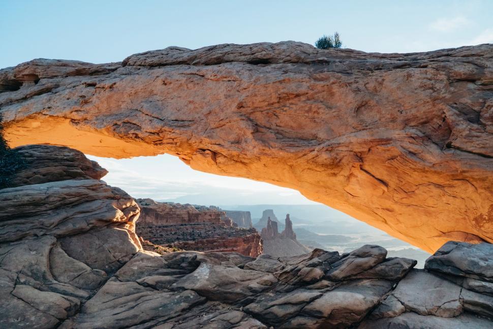 Free Image of Person Standing on Top of Rocky Cliff 