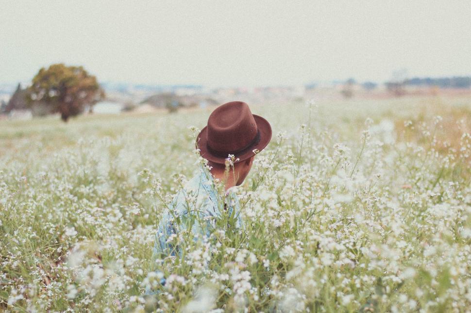 Free Image of Person Wearing Hat Standing in Field 