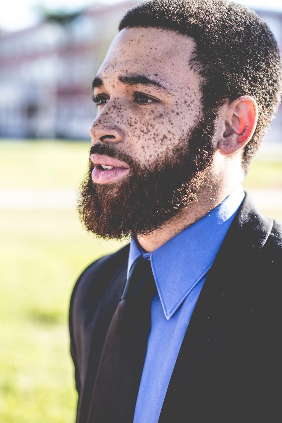 Free Image of Close Up of Person Wearing Suit and Tie 
