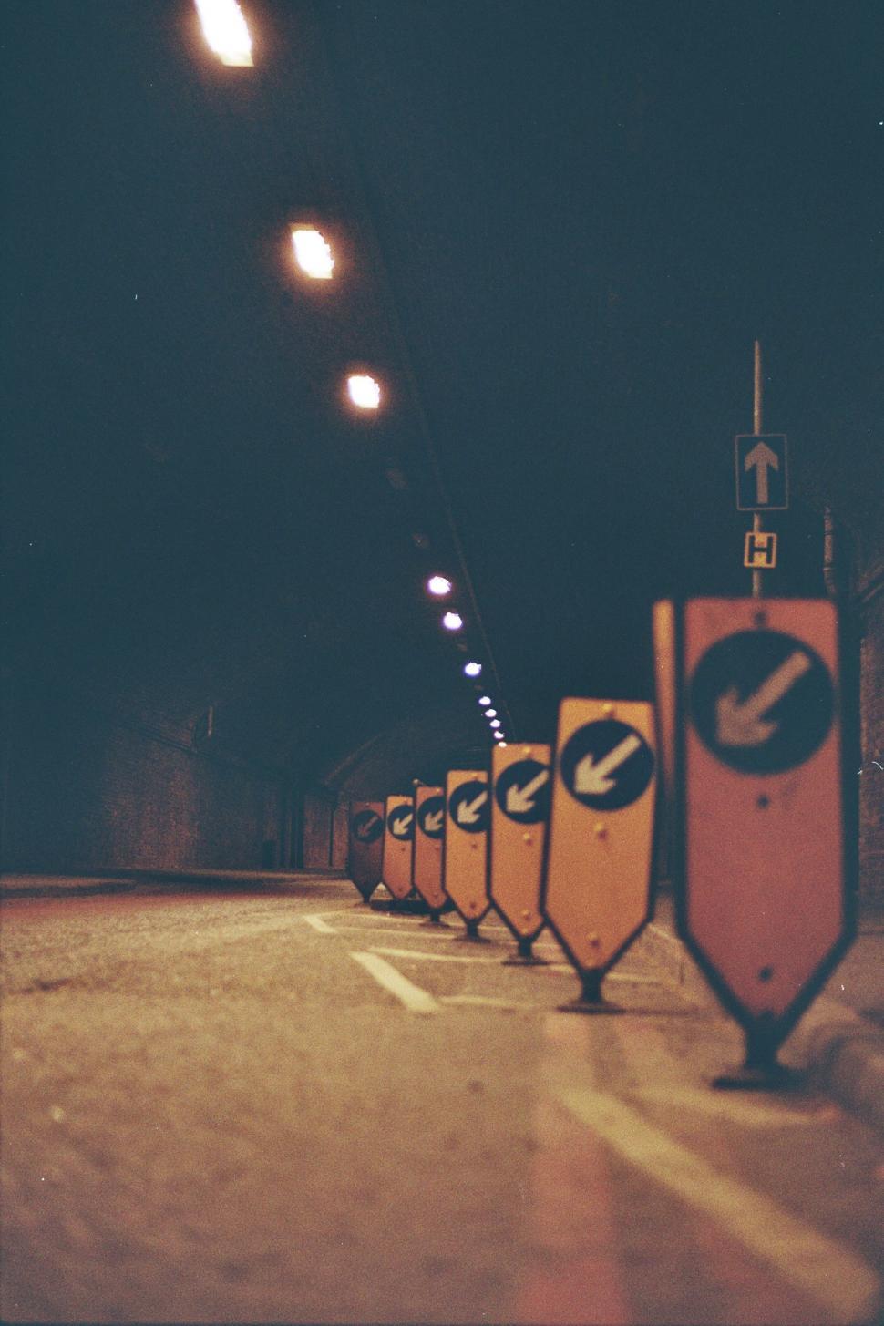 Free Image of Row of Street Signs on Side of Road 
