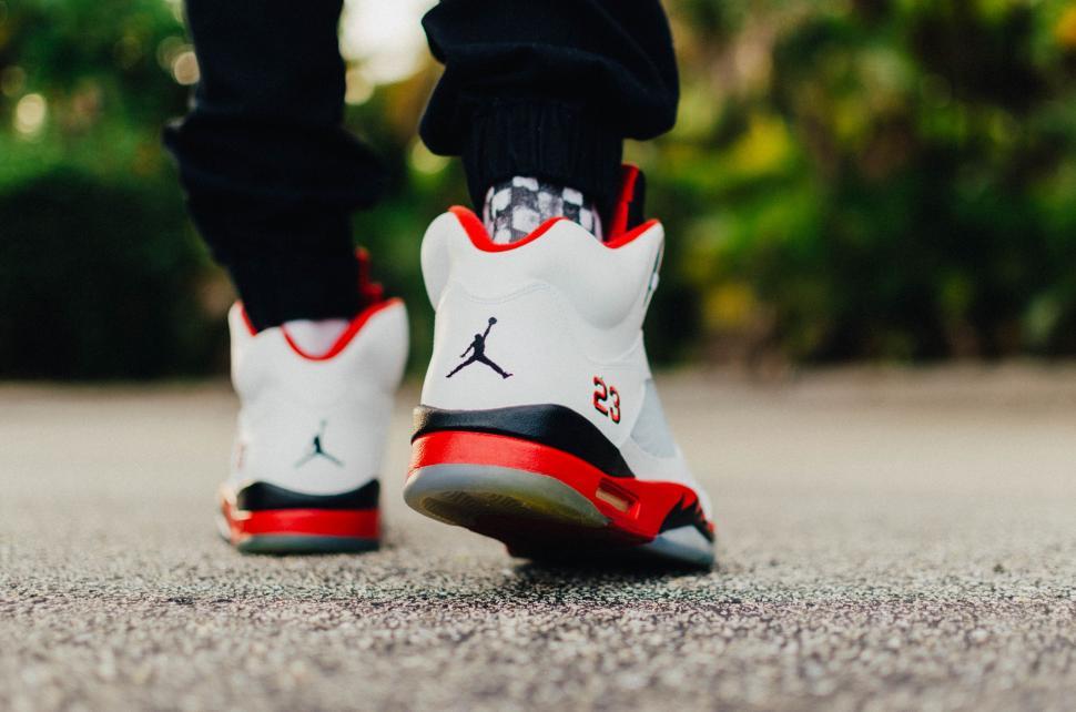 Free Image of Close Up of Persons Shoes on the Ground 