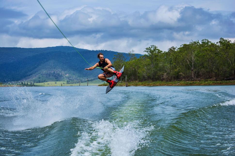 Free Image of Man Riding Wakeboard on Lake 