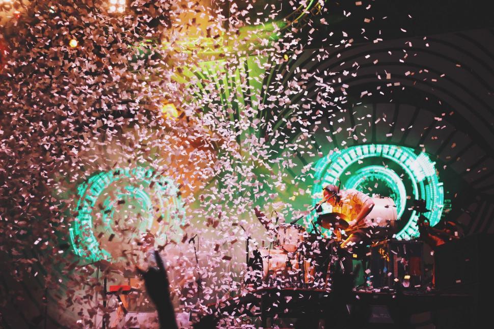 Free Image of Group of People Standing on Top of a Stage 