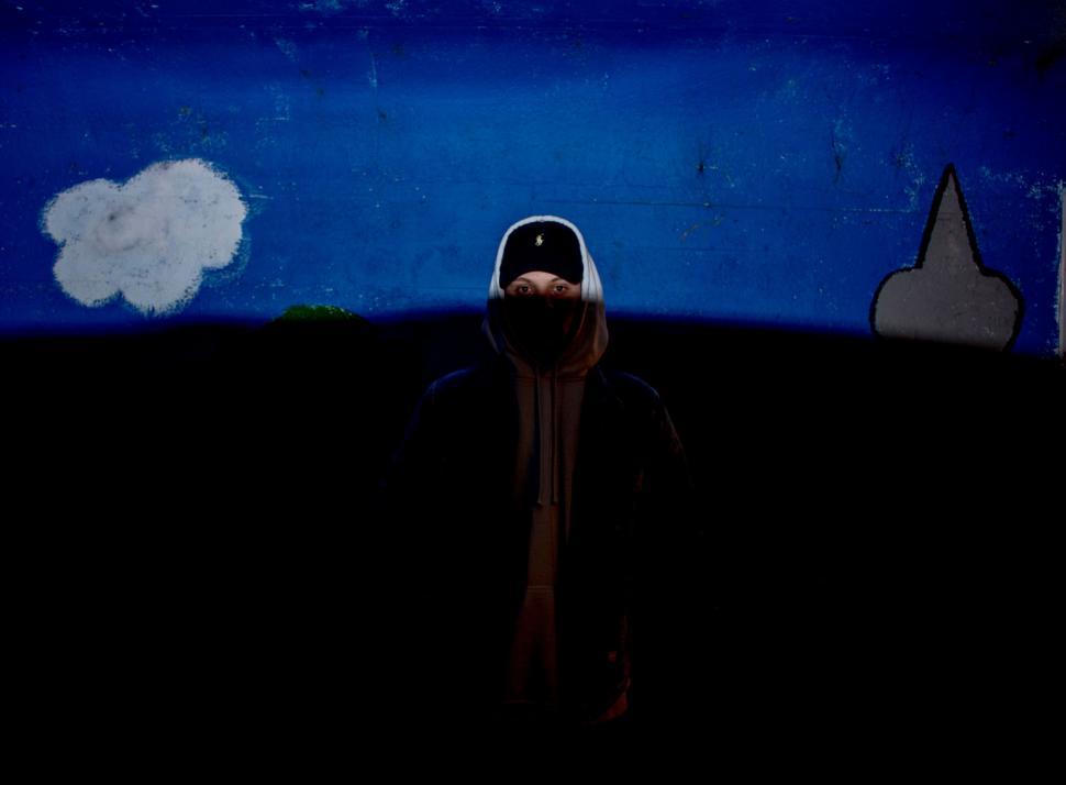 Free Image of Figure Standing in Darkness 