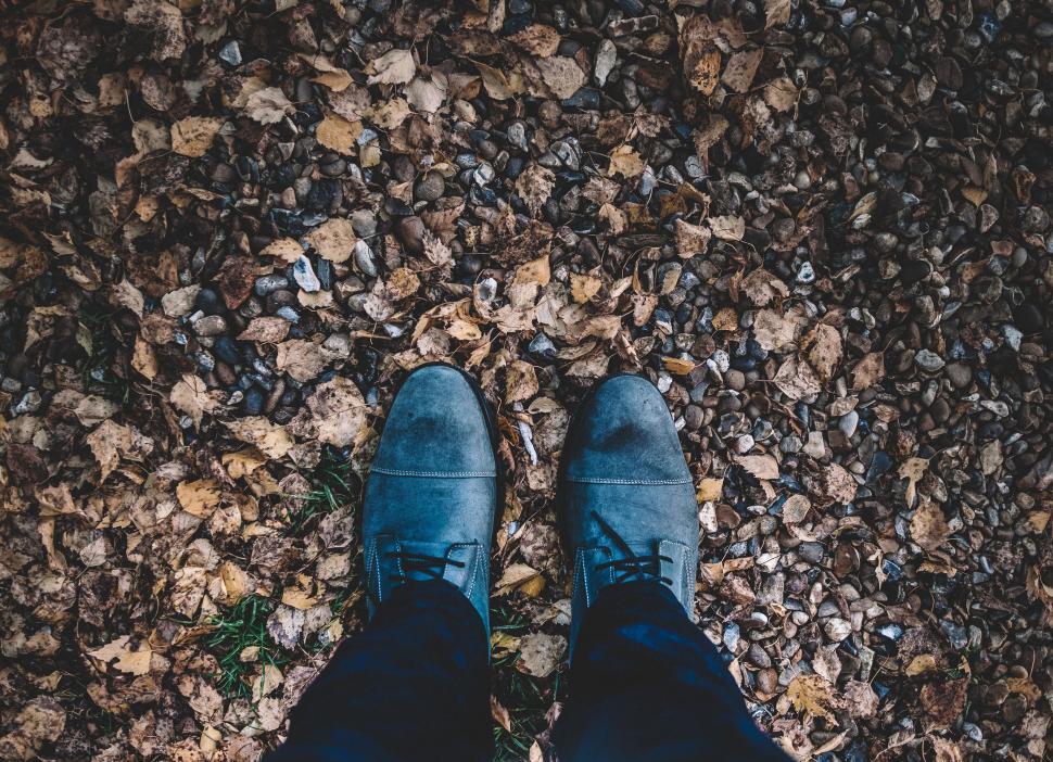 Free Image of Person Standing on Top of Rocky Ground 