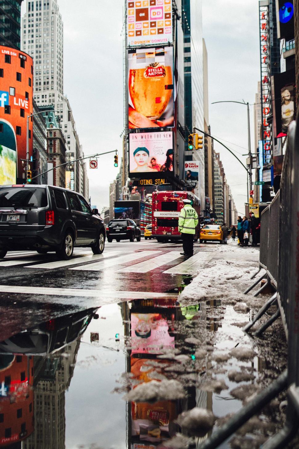 Free Image of Bustling City Street Next to Tall Buildings 