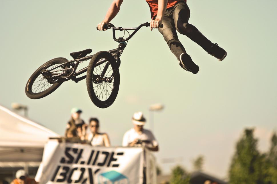 Free Image of Man Riding Bike Flying Through the Air 