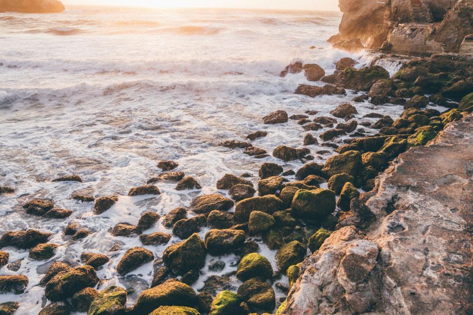 Free Image of Waves Crashing Against Rocky Beach 