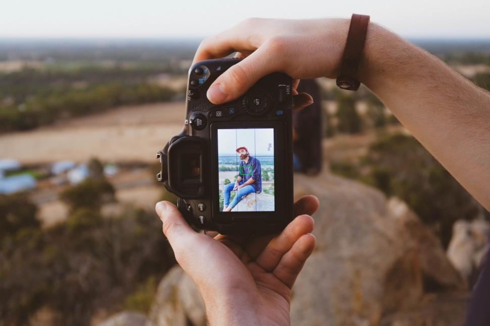 Free Image of Person Holding Camera to Capture Image 