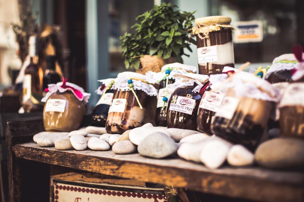 Free Image of Wooden Table Filled With Jars of Food 