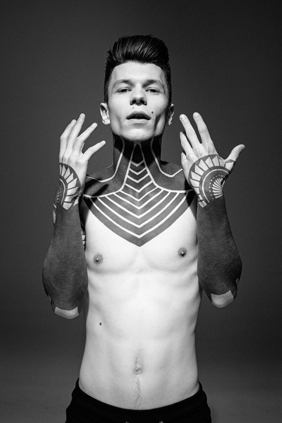 Free Image of Shirtless Man With Hands Raised 