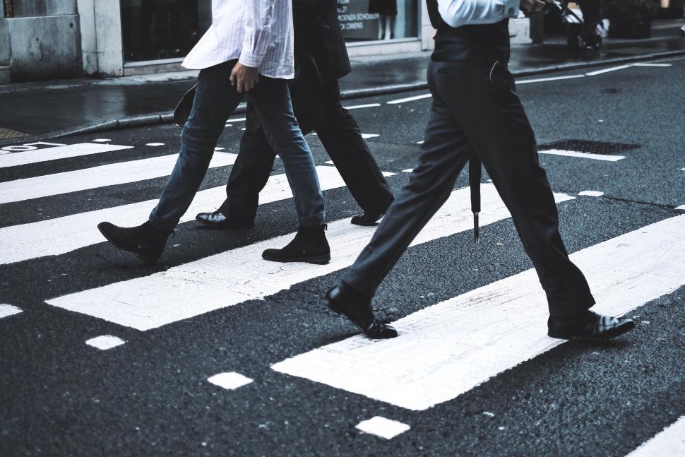 Free Image of Man Crossing Street in Black and White 