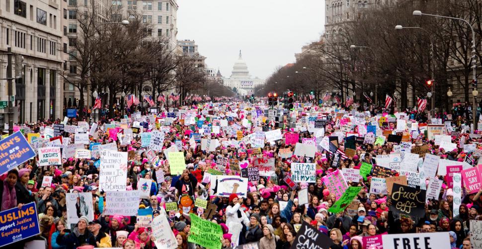 Free Image of Large Group of People Holding Up Signs 