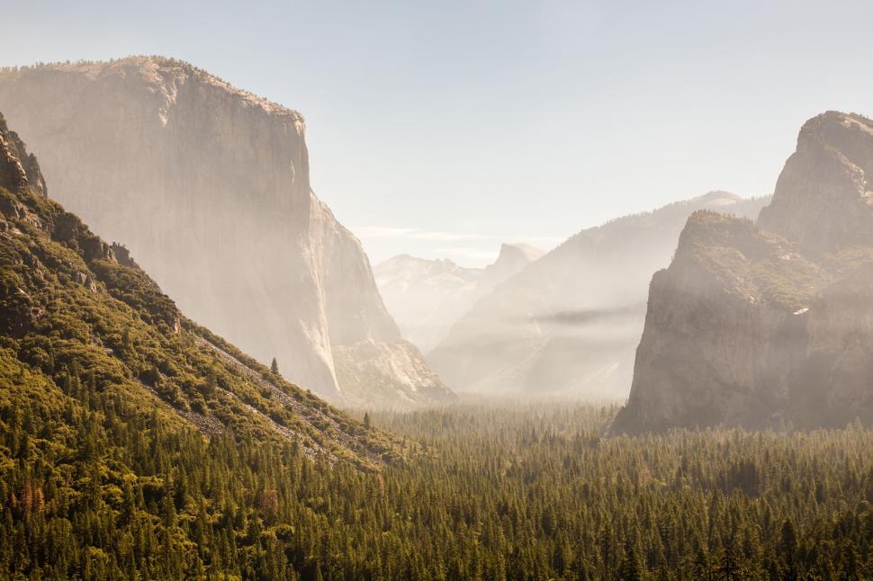Free Image of Majestic Valley With Mountains in Background 
