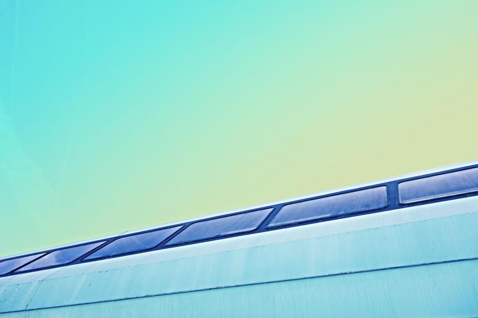 Free Image of Airplane Flying Above Building 