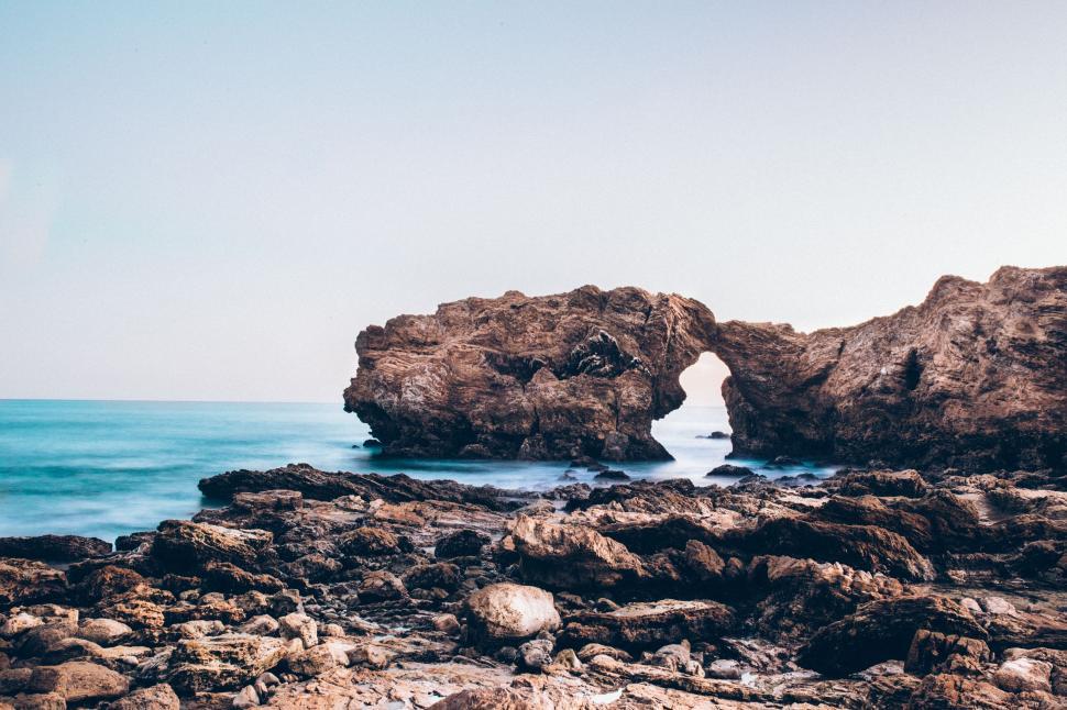 Free Image of Rock Formation Rising From Ocean 